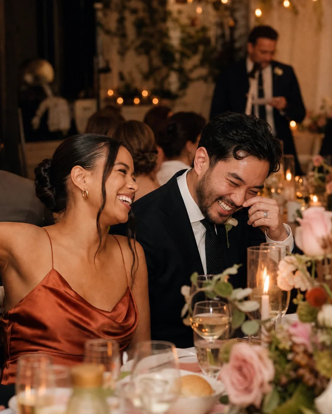 Guests laughing together during an event reception